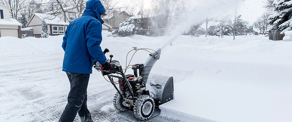 Snow plowing with a snow blower for a residential home owner in Sioux Falls, SD.
