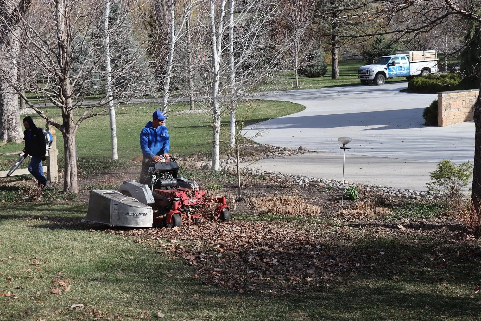 Clearing leaves from a lawn in Sioux City, IA.