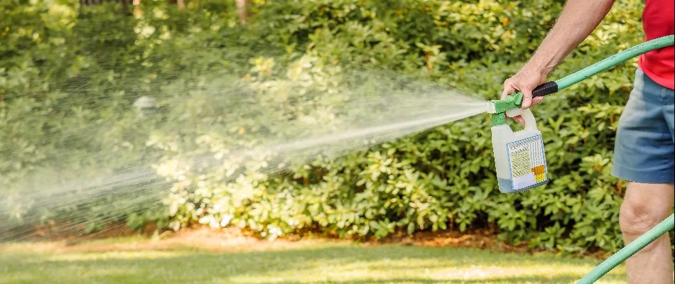 Liquid aeration being sprayed on a lawn.