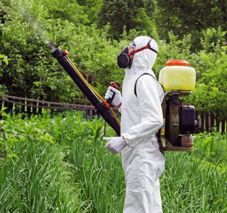 Spraying herbicides in a garden near Sioux Falls, SD.