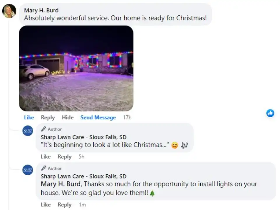 A house at night in Sioux Falls, SD, brightly lit with colorful Christmas lights, with a snow-covered yard and a white car in the driveway.