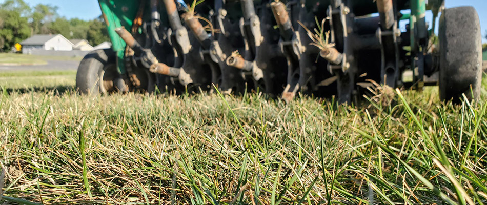 Aerator performing aeration for a lawn in Beresford, SD.