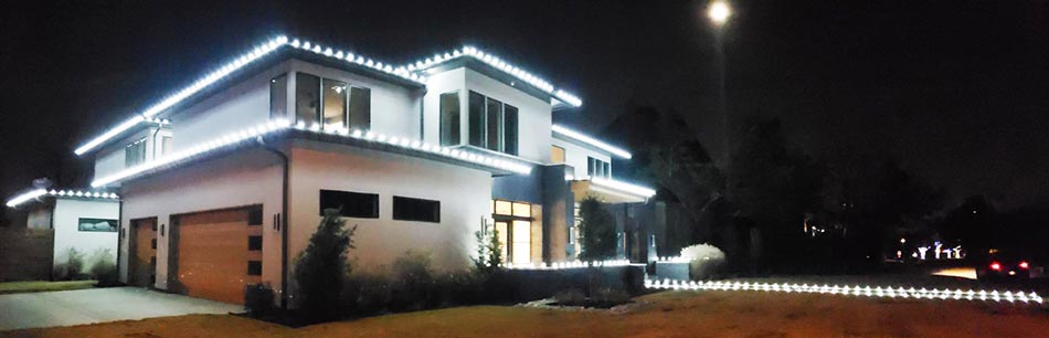 Bright Christmas lights installed on a home in Sioux City, IA.