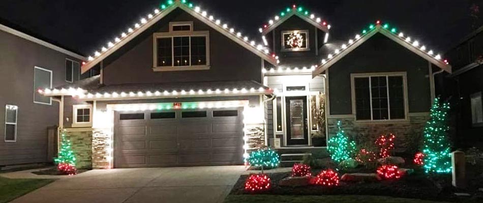 Home with Christmas light decorations installed by Sharp Lawn Care in Sioux Falls, SD.
