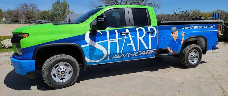 A branding wrapped truck from Sharp Lawn Care in Worthing, SD.