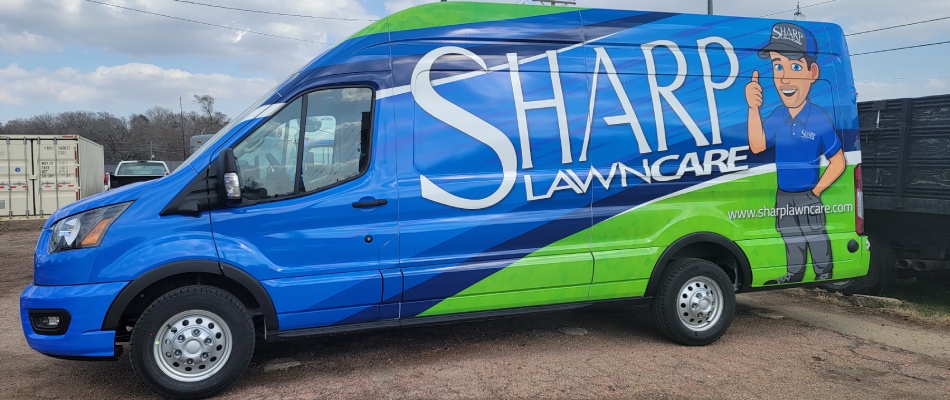Sharp Lawn Care's work van in Sioux City, IA.