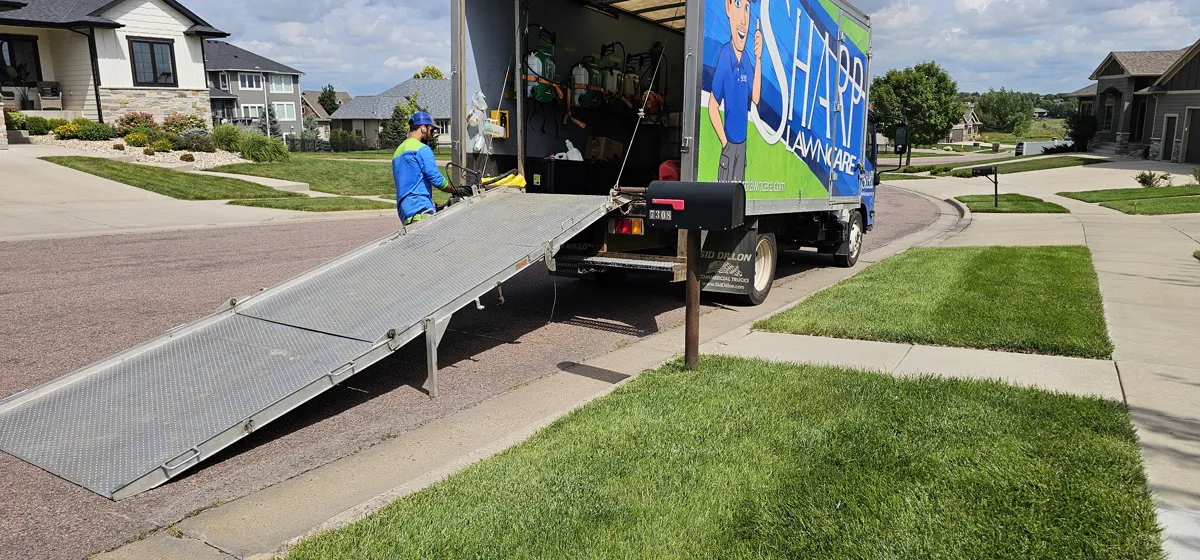 Sharp Lawn Care truck at a residential property in Sioux Falls SD
