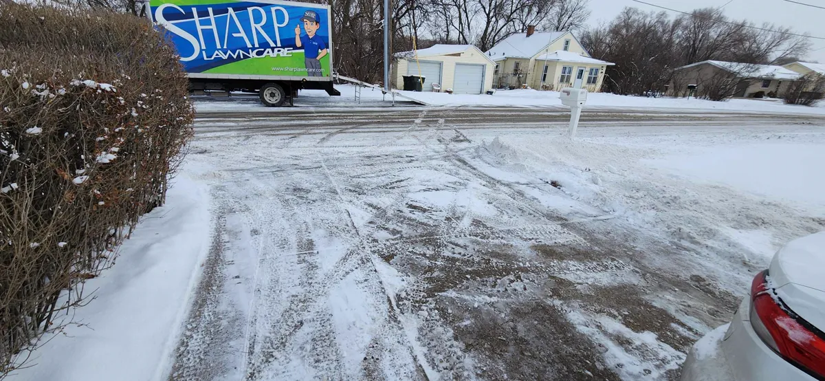 Sharp Lawn Care truck providing snow removal service in Sioux Falls SD