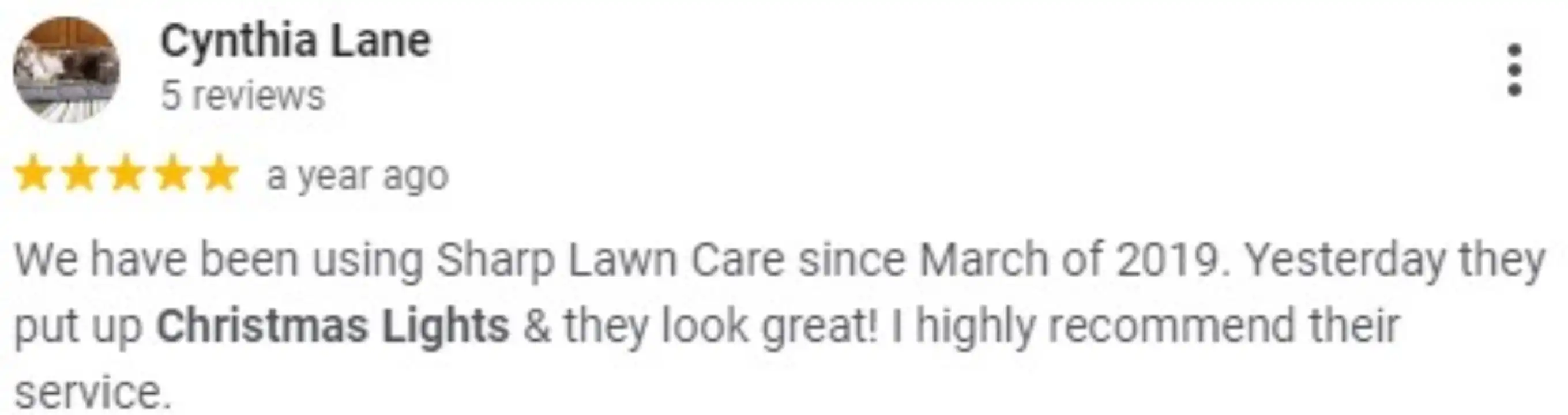 A 5-star review from Cynthia Lane praising Sharp Lawn Care's Christmas light installation service.