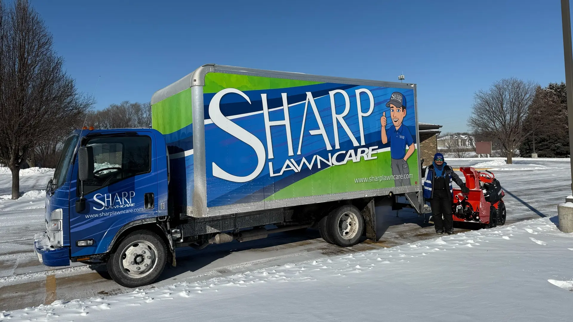 Professional clearing sidewalk from snow with a shovel in Sioux City, IA.