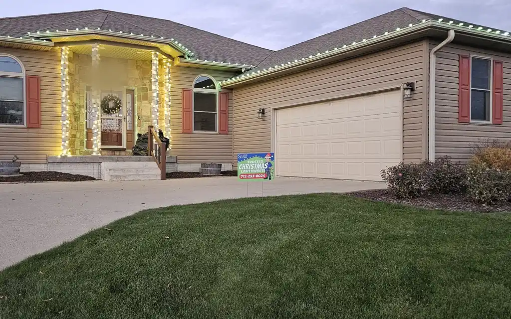 The same Sioux City roof line lit in green