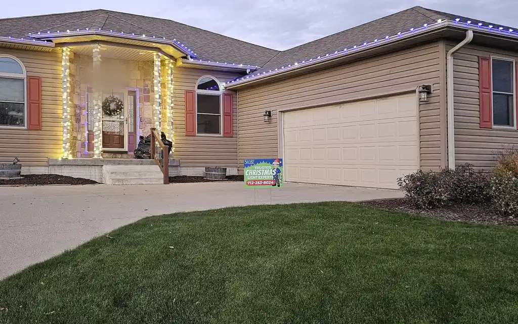 The same Sioux City roof line lit in purple